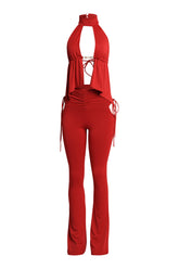 Red halter top with front slit and flared pants set in curve-hugging fit