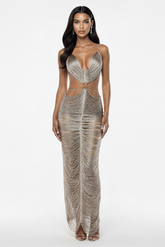 Woman wearing a silver beaded gown on a white background