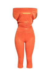 Bold tangerine shimmer set with asymmetric off shoulder styling and vibrant shine