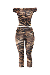 Leopard print off-shoulder top and leggings set on a white background