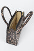 Top view of the open leopard print handbag revealing its beige interior and zippered pocket.