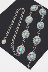 Silver western chain belt styled on mannequin with turquoise stone medallions

