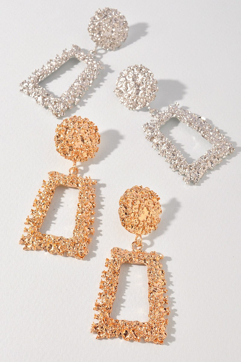 Shiny silver statement earrings in textured alloy with cut-out shape

