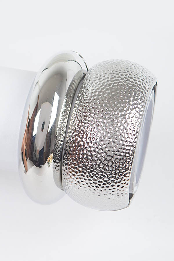 Silver polished bangle bracelet with glossy mirrored metal surface

