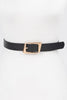 Black faux leather belt with shiny gold square buckle closeup

