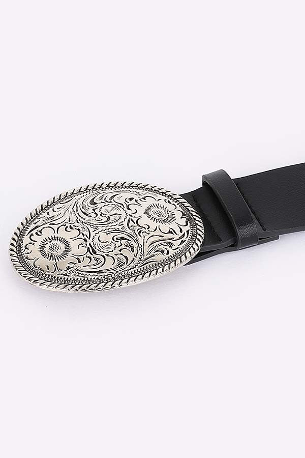 Western-inspired black belt styled on waist with engraved buckle

