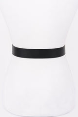 Floral scroll engraved buckle on faux leather waist belt

