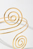 Lightweight gold spiral arm bracelet with sculptural goddess style

