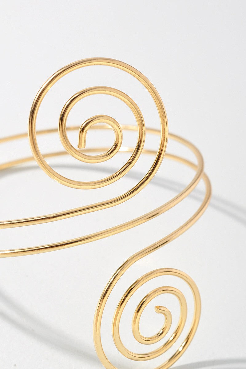 Lightweight gold spiral arm bracelet with sculptural goddess style

