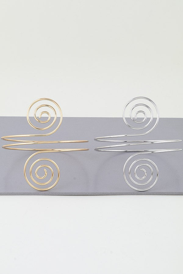 Polished silver cuff bracelet with geometric spiral wire design

