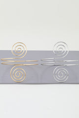 Polished silver cuff bracelet with geometric spiral wire design

