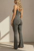 Back view of charcoal gray jumpsuit with scoop back, adjustable straps, and second-skin fabric
