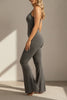 Side profile of a gray flare jumpsuit highlighting stretch fabric and flared leg