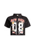 Front view of black New York-themed graphic shirt showcasing bold numerals and city motifs.