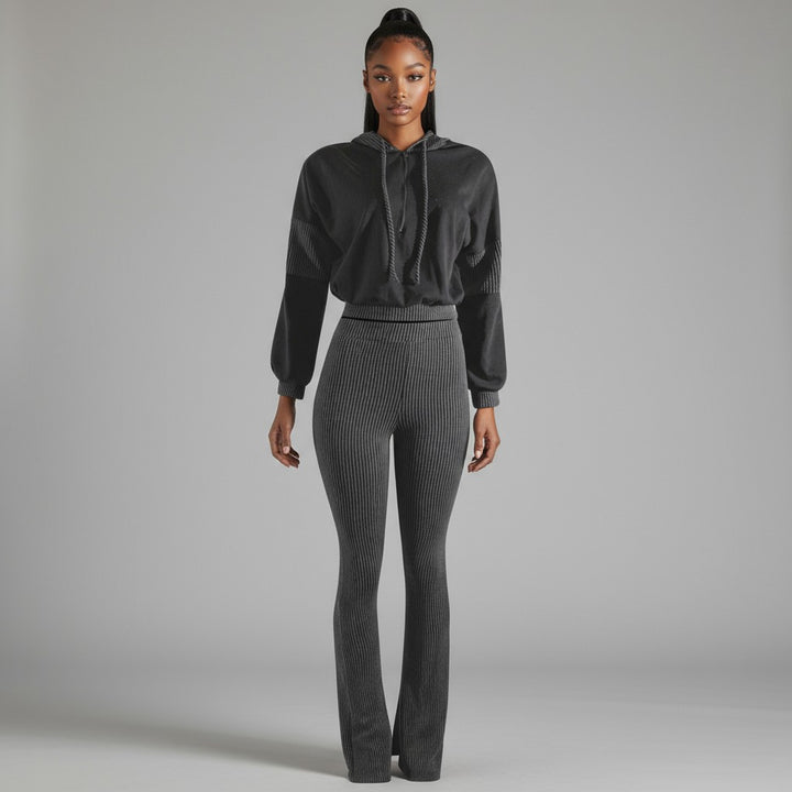 Front view of black ribbed lounge set with colorblock hoodie and flared rib pants