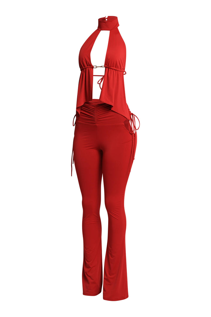 Red halter flare outfit with peekaboo front and elevated going-out style

