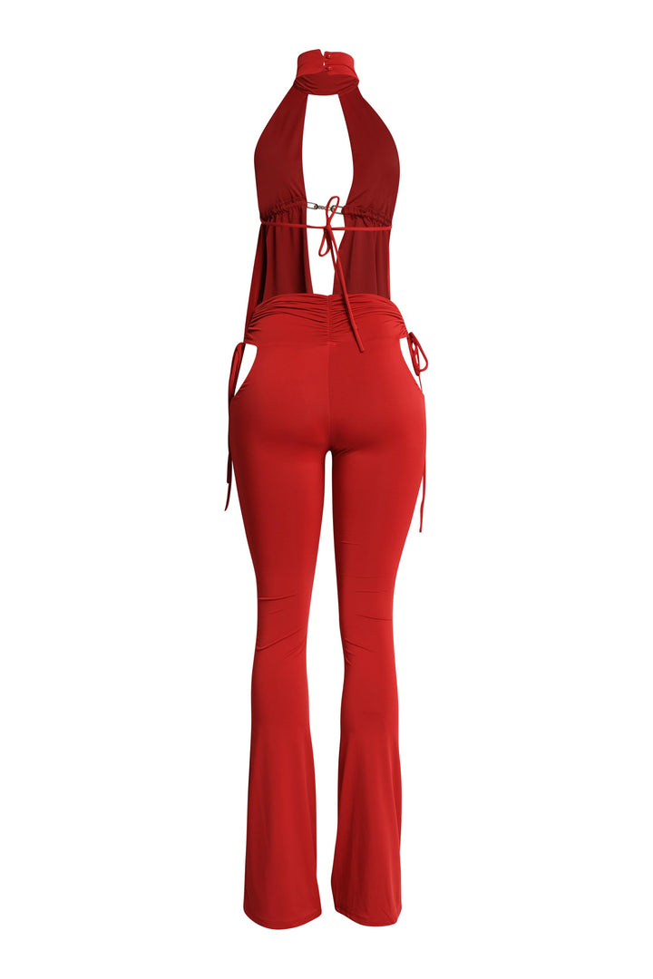 Back shot of red halter pant set showing exposed back and tie detail

