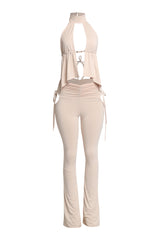 Front view of halter flare set with gold bust trim and flared pants

