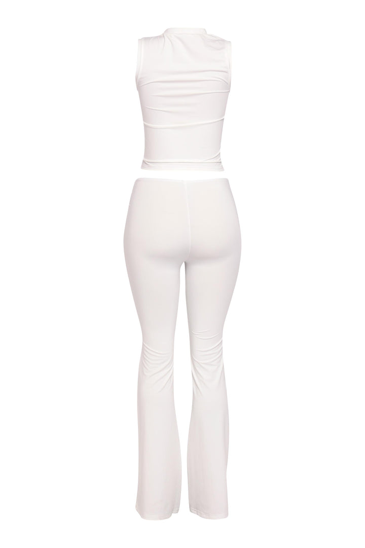 Neutral cream flared pant set with mockneck crop top