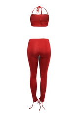 Vibrant red halter crop and lace up pants co-ord with stretch