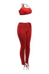 Bold red two piece outfit featuring lace up pants and crop top