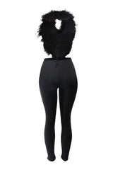 Black party outfit with open back and faux fur