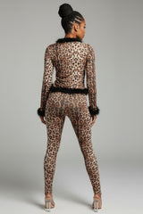 Back view of leopard lounge set with slim fit leggings and feather-detailed hem and cuffs
