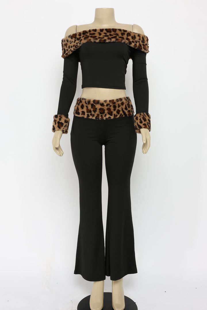 Mannequin wearing a black outfit with leopard print accents on a white background
