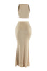 Back view of beige two-piece maxi set highlighting flowy flared hem and body-skimming fit