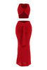 Front angled view of red ruched maxi set with twist front top and bold drape detail