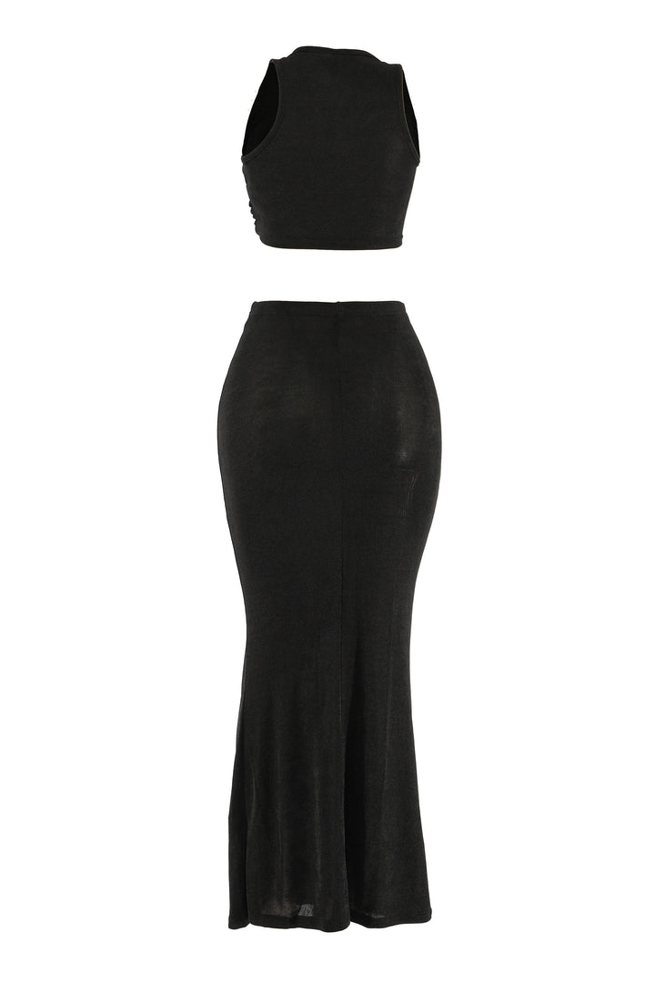 Back view of black sleeveless maxi set with flared hem and sleek finish