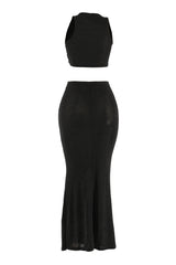 Back view of black sleeveless maxi set with flared hem and sleek finish