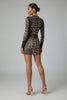 Mesh animal print mini dress back view featuring bold print and second-skin sheer fabric
