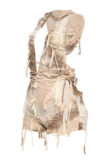 Pale tie-detail romper in sheer grunge mesh with edgy backless design

