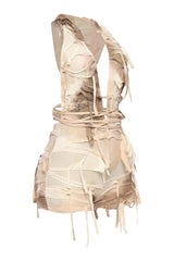 Apocalyptic ivory sleeveless romper with open back and layered fraying

