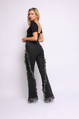 Distressed fringe denim flared pant