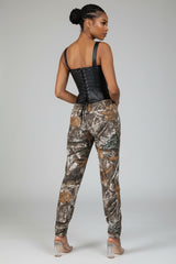 Back view of camo print straight leg trousers featuring real pockets and allover rustic print