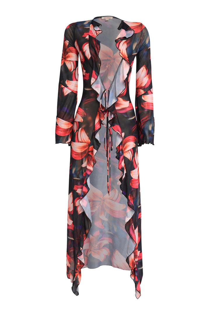 Sheer floral print ruffle tie top in black combo with flared sleeves and cascading front layers styled for elevated vacation glam