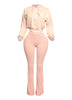 Stylish peach two-piece lounge set with a cropped hoodie and high-waisted flared pants, featuring a ribbed texture for a trendy and flattering fit. Perfect for casual-chic outfits, cozy vibes, and effortless streetwear style.
