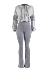 Gray and white color-blocked outfit with a jacket and ribbed pants on a white background