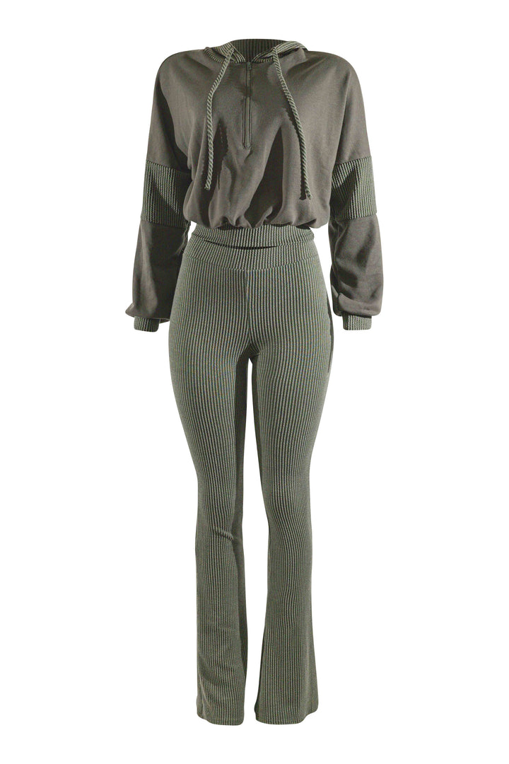 Green tracksuit with hoodie and flared pants on a white background