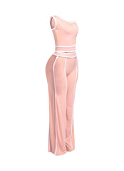 Trendy pastel pink off-shoulder pant set with sleek white accents, ideal for day-to-night transitions or statement outfits.