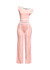 Soft pink off-shoulder pant set with chic white contrast trim, perfect for a feminine and trendy look.