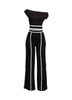 Bold color-contrast off-shoulder pant set with striking white trim, perfect for edgy and statement-worthy looks.
