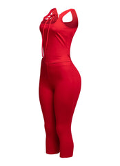 Eye-catching red tank top with tie-front detail and matching capri pants, designed for comfort and style in one.