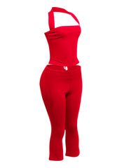 Vibrant red two-piece outfit featuring a halter neck top and cropped capri pants, perfect for making a statement.