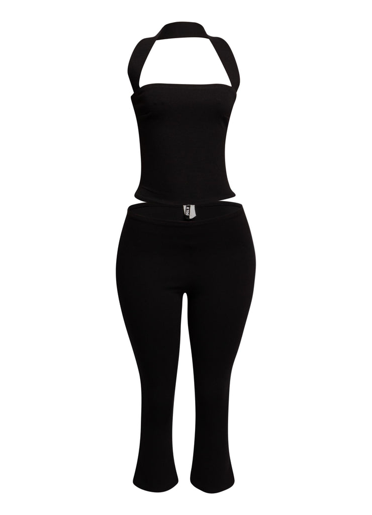 Sleek black halter top and fitted capri pant set, perfect for edgy, on-trend party looks.