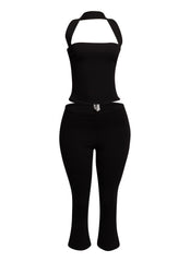 Sleek black halter top and fitted capri pant set, perfect for edgy, on-trend party looks.