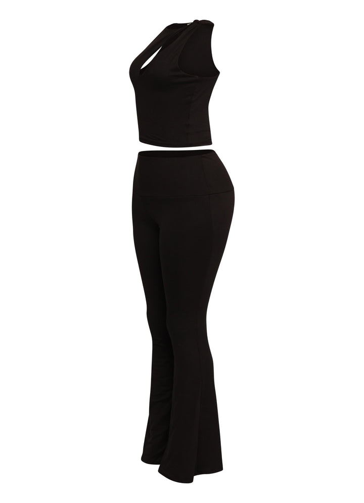 Streetwear-ready black flare pant set with shoulder cut-out crop top for a bold night-out look


