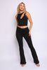 Black twist-strap crop top and flared pants set with edgy cut-out neckline and waist-hugging fit

